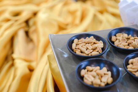peanut in black bowl on buffet easily to takeの写真素材