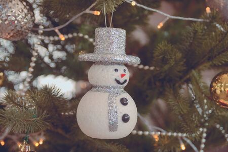 Snowman decorate with decoration on Christmas tree. background for design. Noel. Happy New Year.