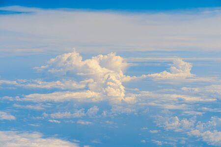 View of clouds and sky from airplane window