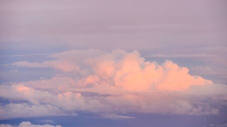 Beautiful view of sunset or sunrise clouds and sky from airplane window