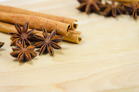 Cinnamon sticks and star anise spice on wooden board