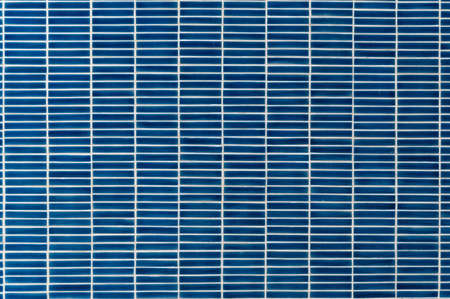 Blue rectangle mosaic tiles interior wall texture background.