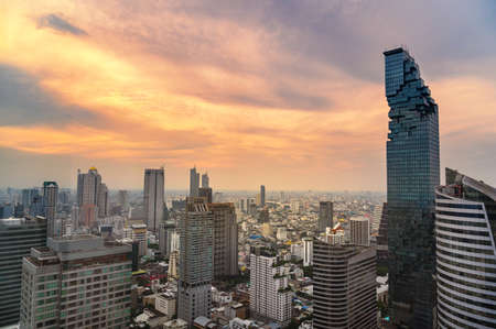 Aerial view of Bangkok city at twilight sunset in Thailand. cityscape of Modern buildings and urban...