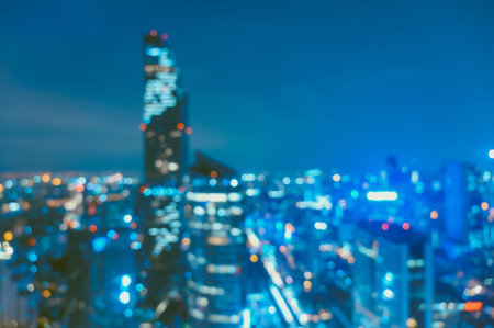 Abstract blurred of urban night light. Defocused of cityscape at night. bokeh light backgroundの写真素材