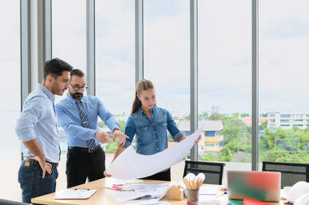 Engineers team meeting for architectural project. architects discussing blueprint with construction...