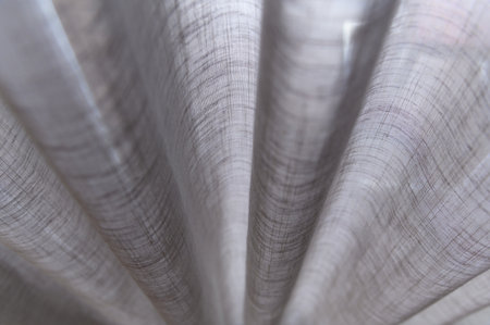 closed up grey sheer curtains. transparent curtain in cozy room home, interior design concept