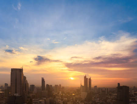 Cityscape of modern buildings and urban architecture. Aerial view of Bangkok city at twilight sunset...