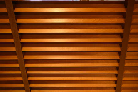 open wooden venetian blinds. lighting range control sunlight coming from a window. decoration interior. Modern jalousieの写真素材