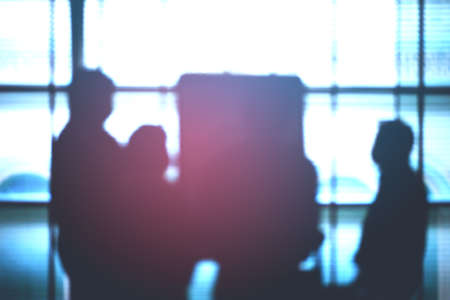 Blurred silhouette of business people meeting and brainstorming with flip chart at corporate office...