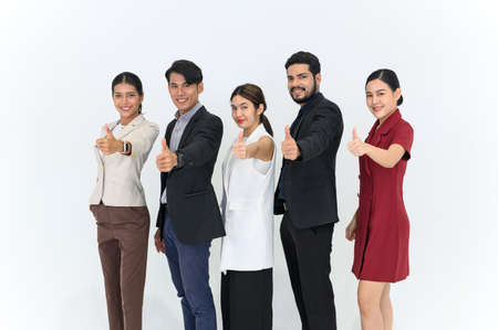 Group portrait of Young AsianÂ Businesspeople standing in a row smiling and showing thumbs up,...