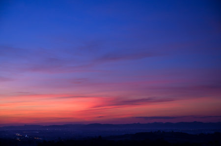 Evening time of panorama mountain under dramatic twilight sky and cloud. Nightfall Silhouette mountain on sunsetの写真素材