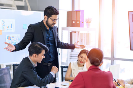 Business people group meeting with laptops in the modern office. Successful business professionals work together with colleagues while analytical reportの写真素材