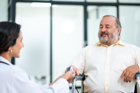 Doctor uses finger pulse oximeter measuring patient man while he sitting in a wheelchair, elderly...