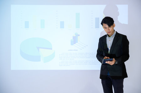 Business man gives presentation to colleagues during meeting, Shows Infographics Animation on Big...