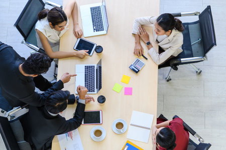 Business people group meeting with laptops from top widen view in the modern office. Successful...