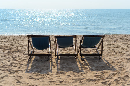 Relax time on the beach. beach chaise set up for travelers on the beach in Thailand on sunny days. Summer vacation and holidayの写真素材