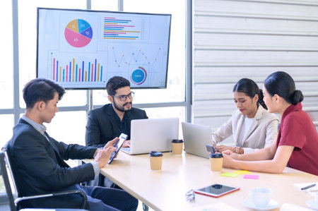 Business people group meeting with laptops in the modern office. Successful business professionals work together with colleagues while analytical reportの写真素材