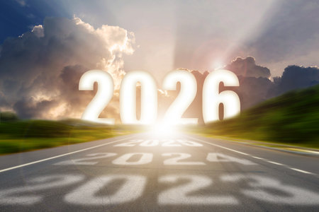 Go to the New Year 2026 concept. Road leading toward bright sunlight with bold 2026 numbers and...