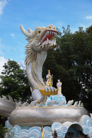 silver dragon  held gold bar with Guanyin at wat Thaton Chiangmai,Thailand
