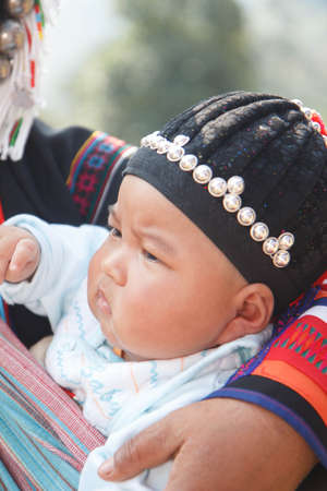CHIANG MAI, THAILAND - FEB  4 : Unidentified  hill tribe was waitting for health service  with traditional clothes and silver jewelery at  Ban muang-ngam on january 27, 2014 in Chiang Mai, Thailand.のeditorial素材