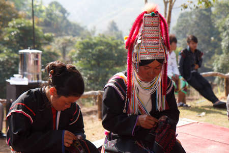 CHIANG MAI, THAILAND - FEB  4 : Unidentified  hill tribe was waitting for health service  with traditional clothes and silver jewelery at  Ban muang-ngam on january 27, 2014 in Chiang Mai, Thailand.のeditorial素材