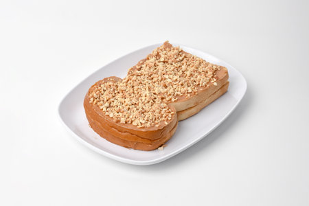 Toast with peanut butter and sesame seeds on a white plate