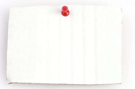 withe cardboard with red thumbtack and space for copyの写真素材