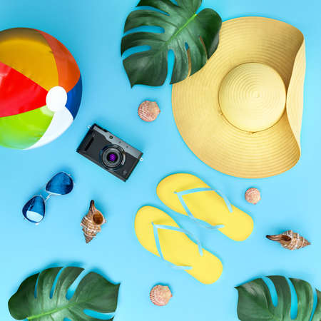 Summer  vacation concept top view  illustration. Flat lay banner illustration of summer symbols. Flip flops, sun glasses, shells, camera, beach ball. 3D rendering.の写真素材