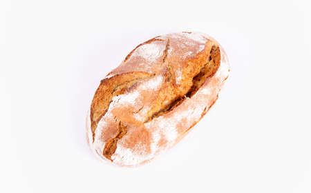 Loaf of bread isolated on white background. Rustic crunchy bread, tasty and natural. Top view.