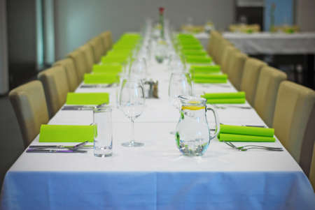 special table with fork and spoon, green papersの写真素材