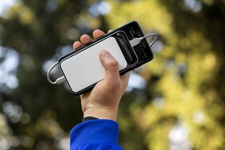 mobile phone charging white powerbankの写真素材