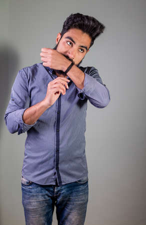 Studio shot of Iraq brunette boy felling sleepy