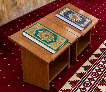 Holly Koran or Quran on wooden table inside mosqueの写真素材