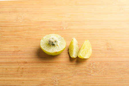 Indian gooseberry slices on white background.の写真素材