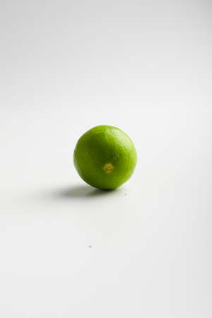 Fresh green lemon on white background.の写真素材