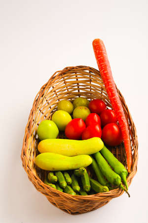 Raw vegetable in wooden basketの写真素材