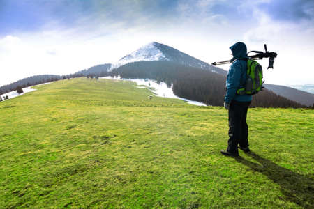 Lonely photographer in mountainsの写真素材