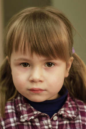 Little girl looking straight aheadの写真素材