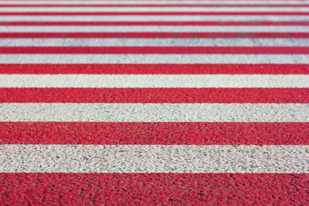 Red and white stripes fading depth of field effect texture backgroundの写真素材