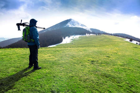 Lonely photographer in mountainsの写真素材