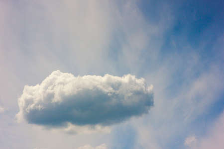 Blue sky with puffy white cloud in bright clear sunny dayの写真素材