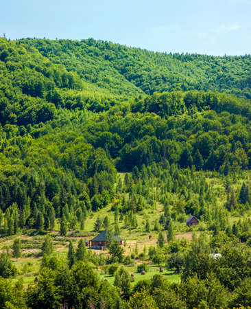 Lonely house in green mountainsの写真素材