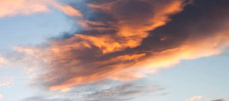 Dramatic sunset sky with beames of light through cloudsの写真素材