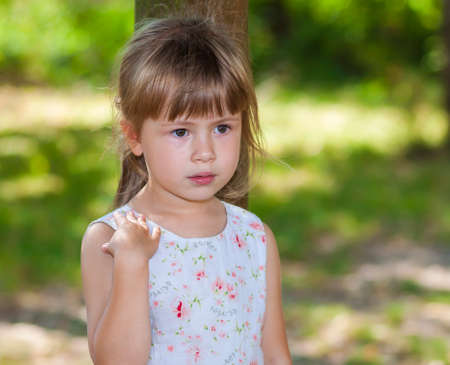 Portrait of a little girl on a sunny dayの写真素材