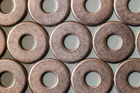 Joiner's accessories. Stacks of metal screw washers isolated on white background.の写真素材
