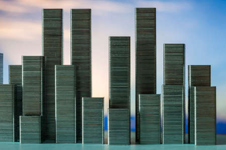 Staples arranged to form city skyline on a sunset backgroundの写真素材