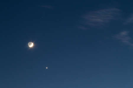 Night blue sky with bright moon and single star