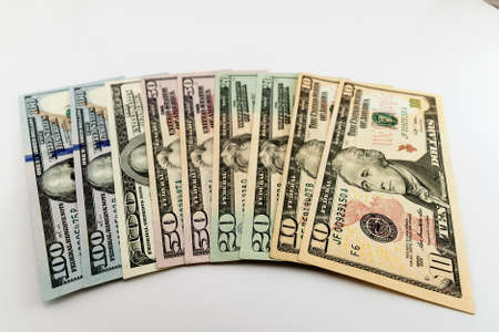US american dollar money bills spread on white backgroundの写真素材
