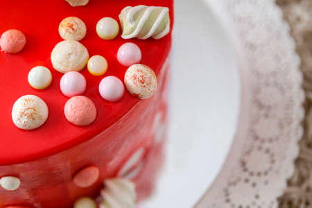 Homemade red birthday cake with air baloonsの写真素材