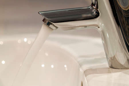 Bathroom interior with sink and faucet valve.の写真素材